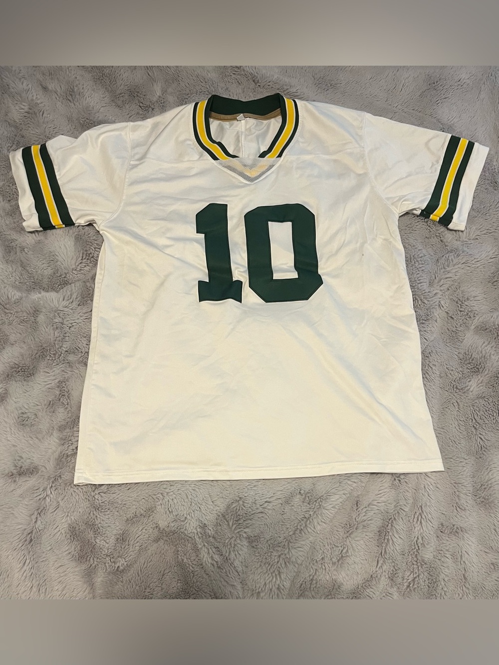 White Athletic Jersey with Green Number 10 and Yellow Trim